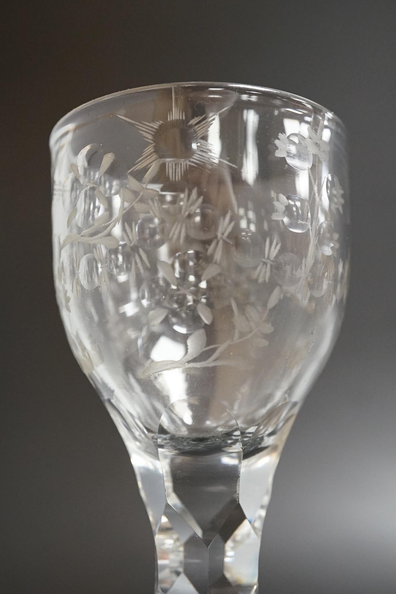 An opaque twist firing glass with terraced foot and a faceted wine glass with domed foot, c.1760, tallest 14cm